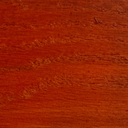Stain and Finish wood swatch in Red Rock, vibrant brick-red tone with swirling natural wood grain texture