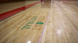 Vermont Natural Coatings MVP Floor Finish being applied to a gym floor